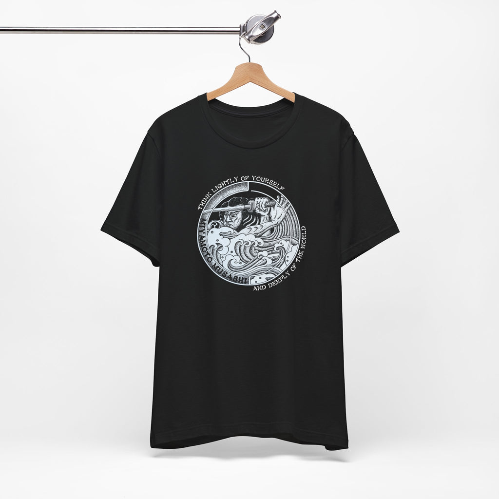 Black Bella Canvas Musashi pointillism tee flat lay — original hand-drawn samurai art by CK Mackie