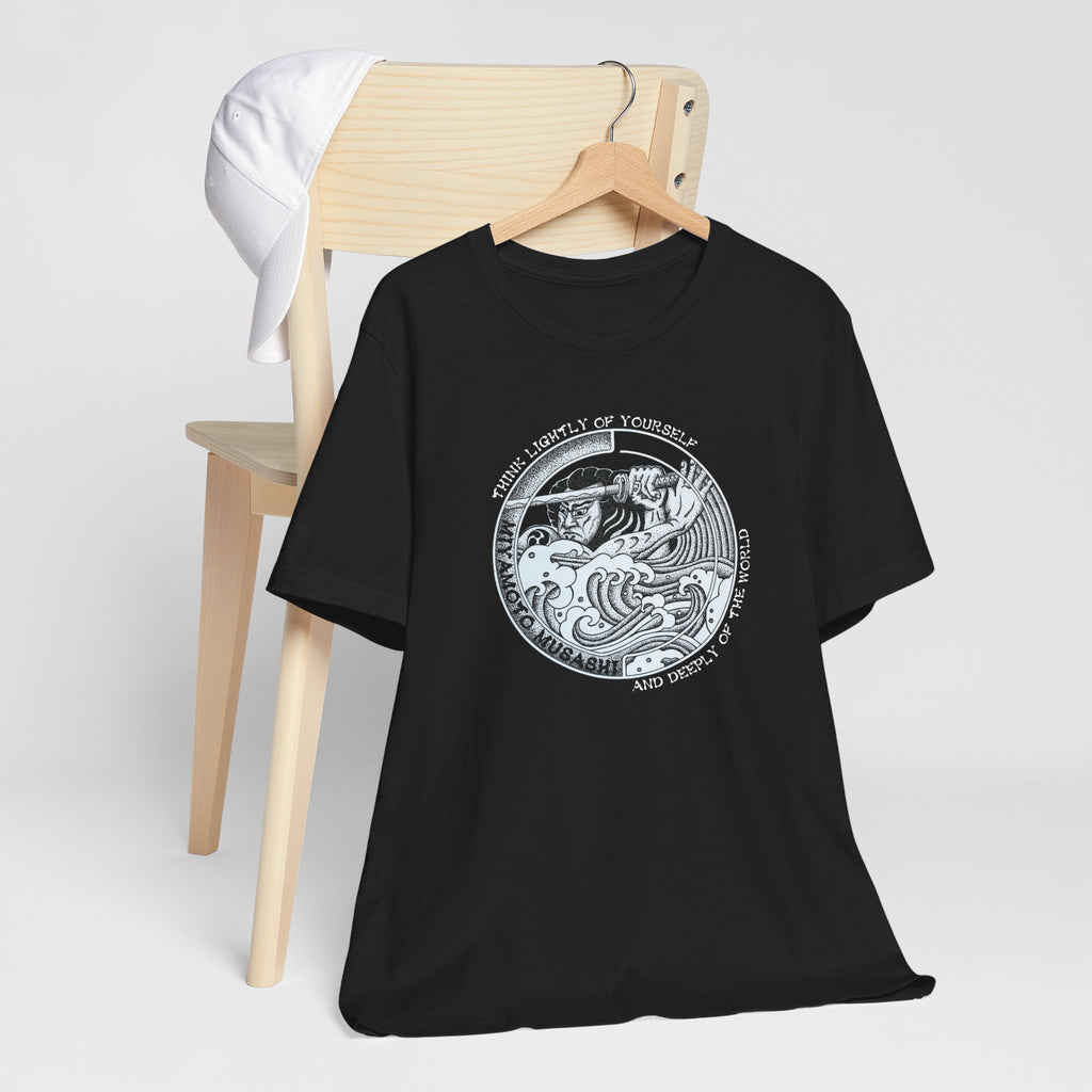 Black Bella Canvas Musashi pointillism tee flat lay — original hand-drawn samurai art by CK Mackie