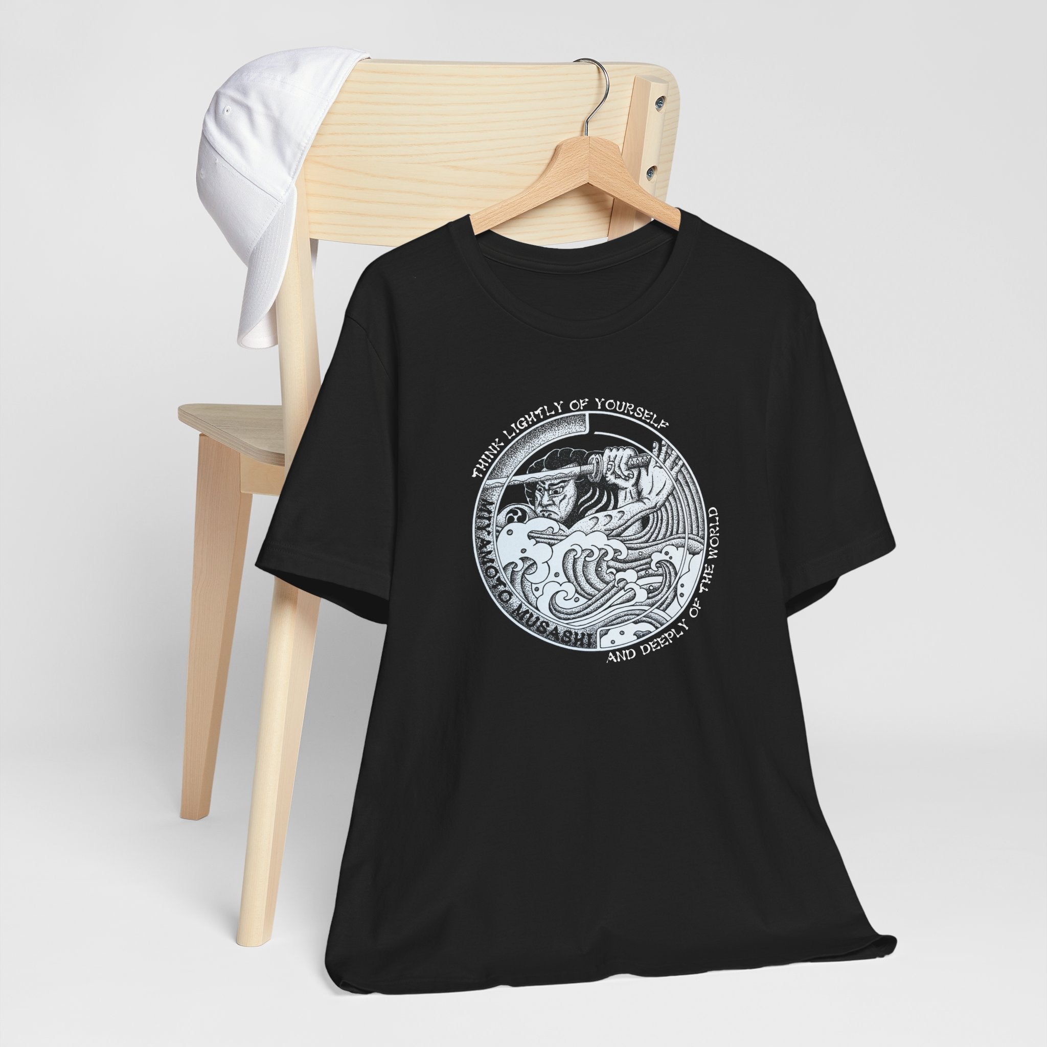 Black Bella Canvas Musashi pointillism tee flat lay — original hand-drawn samurai art by CK Mackie